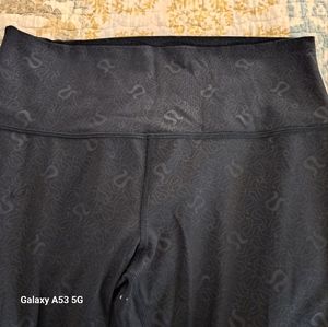 Lululemon women's screen printed with the sign of the company on them